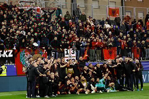 Albania players pose with fans at the end of a World Cup 2026 group K qualifying soccer match between Andorra and Albania in Encamp, Andorra.