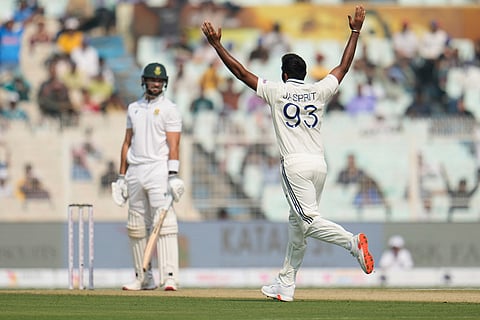 India's Jasprit Bumrah celebrates the dismissal of South Africa's Aiden Markram, left, on the first day of the first cricket test match between India and South Africa in Kolkata.