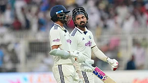 | Photo: AP/Aijaz Rahi : India's KL Rahul, right, and batting partner Washington Sundar walk off the field at the end of play on the first day of the first cricket test match between India and South Africa in Kolkata.