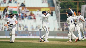 | Photo: AP/Aijaz Rahi : Indian players celebrate as South Africa's captain Temba Bavuma walks off the field after losing his wicket on the first day of the first Test at Eden Gardens on Friday, November 14, 2025.