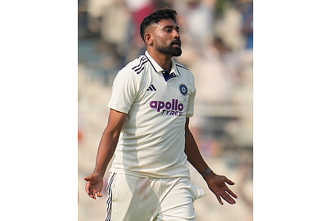 India's Mohammed Siraj celebrates the dismissal of South Africa's Marco Jansen on the first day of the first cricket test match between India and South Africa in Kolkata.