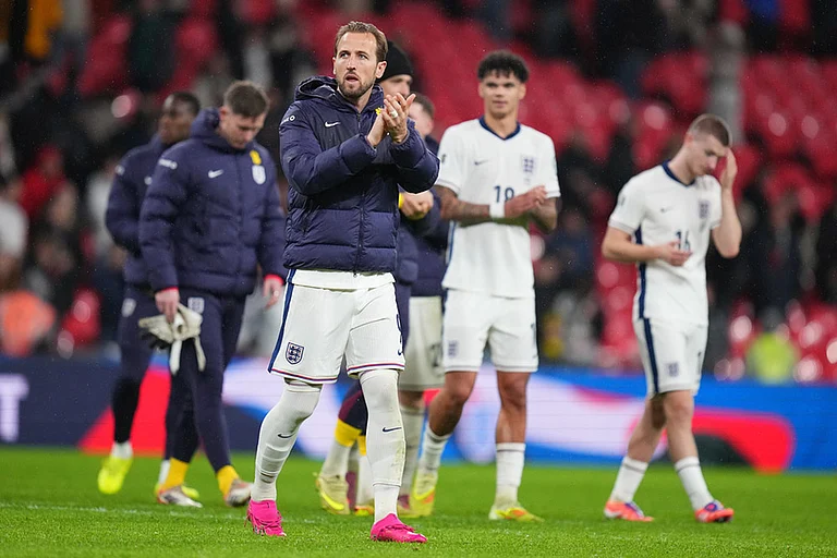 England's Harry Kane walks ooff the pitch after a World Cup qualifier group K soccer match between Serbia and England in London. - | Photo: AP/Kirsty Wigglesworth