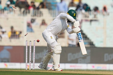 South Africa's Ryan Rickelton is bowled out by India's Jasprit Bumrah on the first day of the first cricket test match between India and South Africa in Kolkata.