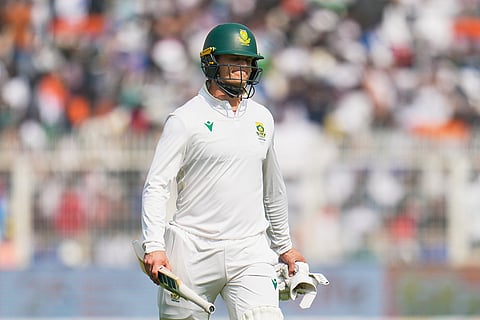 South Africa's Ryan Rickelton reacts as he walks off the field after losing his wicket on the first day of the first cricket test match between India and South Africa in Kolkata.