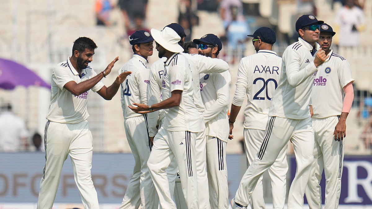 India Vs South Africa, 1st Test Match Day 1: India's Jasprit Bumrah, left, celebrates with teammates after the dismissal of South Africa's Aiden Markram on the first day of the first cricket test match between India and South Africa in Kolkata, India, Friday, Nov. 14, 2025. -  (AP Photo/Aijaz Rahi)