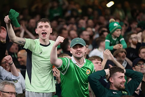 Ireland fans celebrate at the end of a World Cup 2026 group F qualifying soccer match between Ireland and Portugal in Dublin.