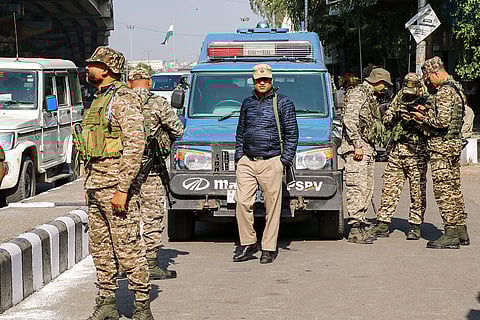Security personnel keep vigil during the counting of votes for the Nagrota assembly constituency bypoll, in Jammu district.