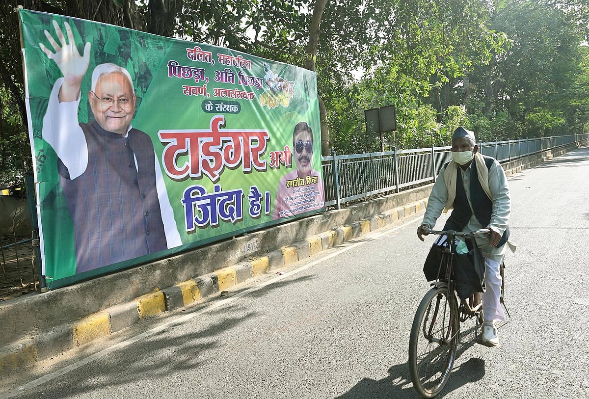 JDU supporters put posters reading Tiger Zinda Hai featuring Bihar CM Nitish Kumar outside of JDU office on the eve of vote counting for Bihar Assembly Elections 2025 on November 13, 2025 in Patna, India. - IMAGO / Hindustan Times