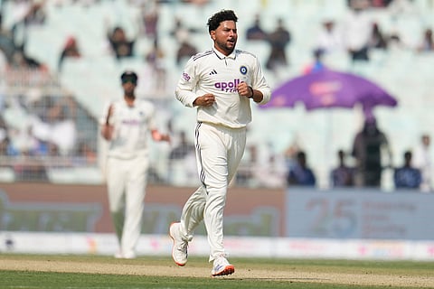 India's Kuldeep Yadav celebrates the dismissal of South Africa's Wiaan Mulder on the first day of the first cricket test match between India and South Africa in Kolkata.