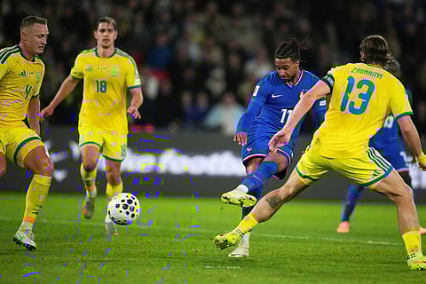 France's Michael Olise scores his side's second goal during a World Cup 2026 group D qualifying soccer match between France and Ukraine in Paris.