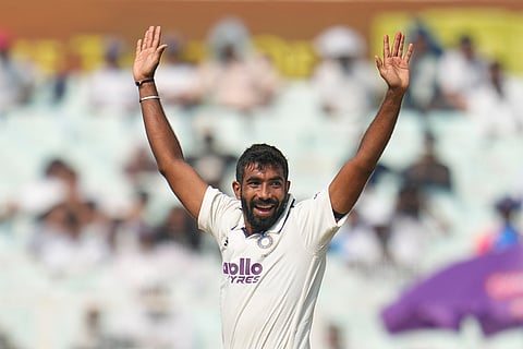 India's Jasprit Bumrah celebrates the dismissal of South Africa's Tony de Zorzi on the first day of the first cricket test match between India and South Africa in Kolkata.