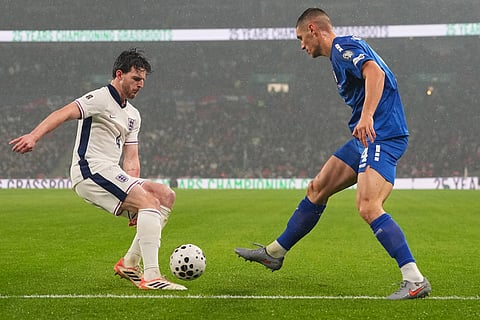 England's Declan Rice, left, and Serbia's Nikola Milenkovic fight for the ball during a World Cup qualifier group K soccer match between Serbia and England in London.