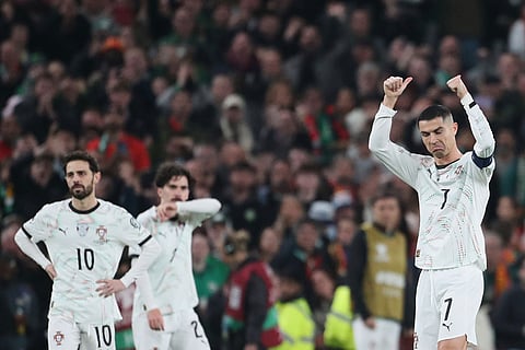 Portugal's Cristiano Ronaldo, right, leaves the pitch after being shown a red card during a World Cup 2026 group F qualifying soccer match between Ireland and Portugal in Dublin.