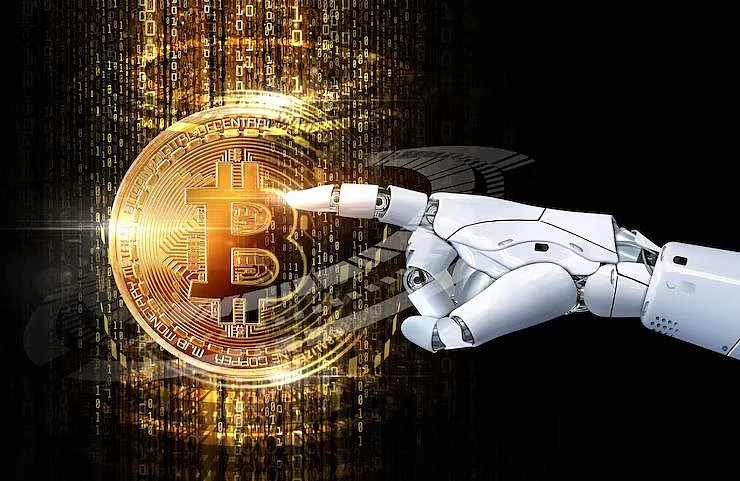 Robot hand touches Bitcoin