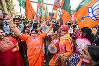 | Photo: PTI : BJP supporters celebrate as the NDA alliance leads during the counting of votes of the Bihar Assembly elections, in Patna.