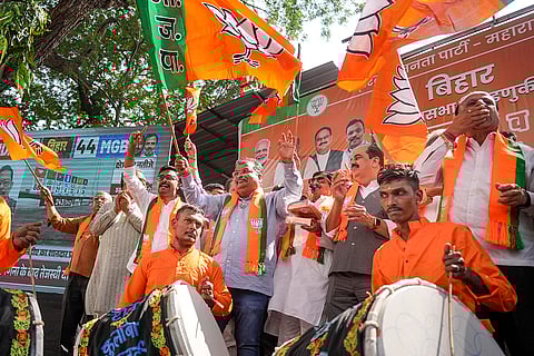 Maharashtra BJP President Ravindra Chavan with party workers celebrate as the NDA alliance leads during the counting of votes of the Bihar Assembly elections, in Mumbai.