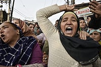 Family members and relatives of Mohammad Shafi Parry, who was killed in a blast at the Nowgam police station, raise slogans as they protest demanding handover of his mortal remains, in Srinagar, Jammu and Kashmir
