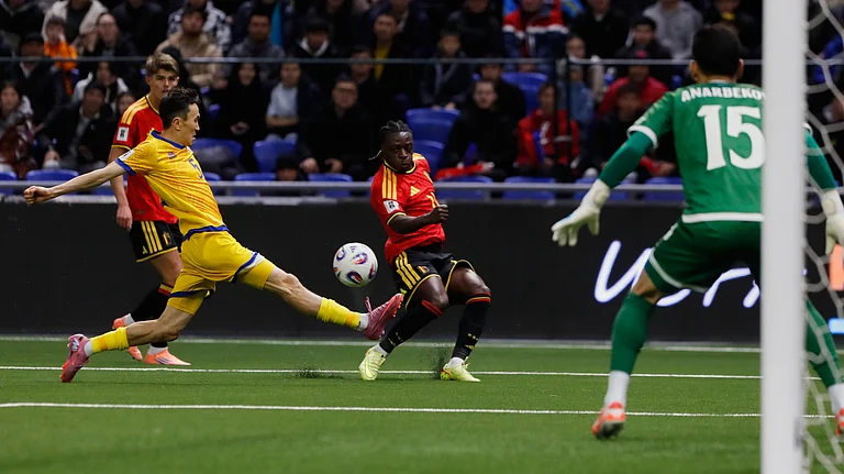 Kazakhstan's Islambek Kuat and Belgium's Jeremy Doku challenge for the ball during the 2026 World Cup group J qualifying match in Astana on Saturday, November 15, 2025. - | Photo: AP/