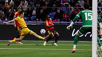 | Photo: AP/ : Kazakhstan's Islambek Kuat and Belgium's Jeremy Doku challenge for the ball during the 2026 World Cup group J qualifying match in Astana on Saturday, November 15, 2025.