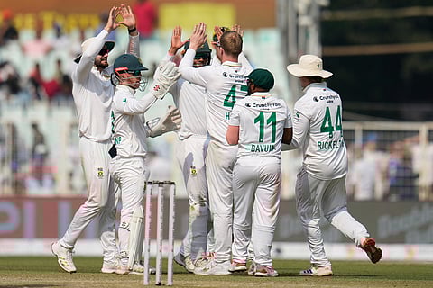South Africa's Simon Harmer, third right, celebrates with teammates after the dismissal of India's Dhruv Jurel on the second day of the first cricket test match between India and South Africa in Kolkata.