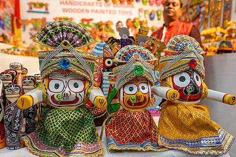Wooden handcrafted idols of Lord Jagannath, Lord Balabhadra and Goddess Subhadra are displayed at a stall during an event to promote Odisha tourism in Bengaluru, Karnataka.