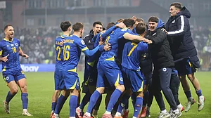 Photo: AP : Bosnia-Herzegovina Vs Romania Highlights, FIFA World Cup Qualifiers: Haris Tabakovic, centre, celebrates with teammates after scoring his side's third goal.