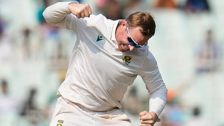 South Africa's Simon Harmer celebrates the dismissal of India's Ravindra Jadeja on the second day of the first cricket test match between India and South Africa in Kolkata, India, Saturday, Nov. 15, 2025. - (AP Photo/Aijaz Rahi)