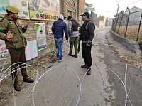 Yasir Iqbal : Security personnel stand guard near the blast site inside Nowgam police station in Srinagar.