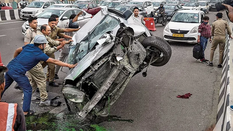 a group of people overturning a car post accident