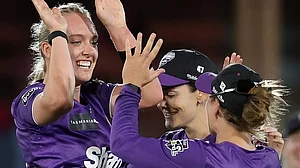 X/WBBL : Hobart Hurricanes bowlers celebrate a wicket against Brisbane Heat