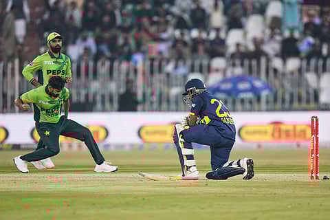 Pakistan's Haris Rauf, left, celebrates after his dismissal of Sri Lanka's Sadeera Samarawickrama, right, during the second one day international cricket match between Pakistan and Sri Lanka, in Rawalpindi, Pakistan.