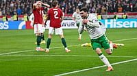 Hungary 2-3 Ireland Highlights, FIFA World Cup European Qualifiers: Parrott Snatches Last-Gasp Playoff Spot For IRL Photo: AP : Hungary Vs Republic Of Ireland Highlights, FIFA World Cup 2026 European Qualifiers: Troy Parrott, right, celebrates after scoring his side's third goal.