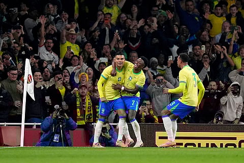 Brazil's Casemiro, left, celebrates scoring their side's second goal of the game during an international soccer match between Brazil and Senegal at the Emirates Stadium, London.