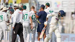 (AP Photo/Aijaz Rahi) : India's Ravindra Jadeja, right, reacts as he walks off the field after losing his wicket on the third day of the first cricket test match between India and South Africa in Kolkata, India, Sunday, Nov. 16, 2025.