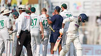 (AP Photo/Aijaz Rahi) : India's Ravindra Jadeja, right, reacts as he walks off the field after losing his wicket on the third day of the first cricket test match between India and South Africa in Kolkata, India, Sunday, Nov. 16, 2025.