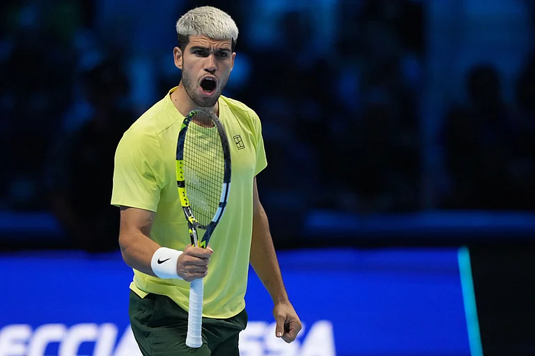 Spain's Carlos Alcaraz celebrates after winning semifinal tennis match of the ATP World Tour Finals against Canada's Felix Auger-Aliassime, in Turin, Italy. - | Photo: AP/Antonio Calanni