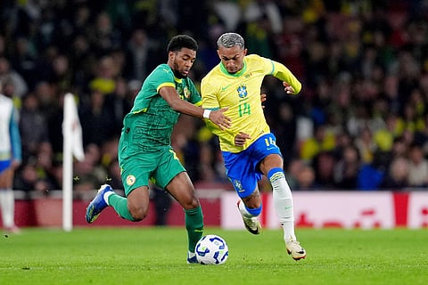 Senegal's Ibrahim Mbaye, left, and Brazil's Wesley for the ball during an international soccer match between Brazil and Senegal at the Emirates Stadium, London.