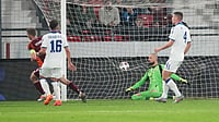 AP/Darko Vojinovic : Latvia's Vladislavs Gutkovskis, left, scores his side's first goal with during the World Cup group K qualifying soccer match.