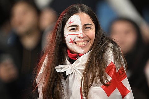 A Georgia's fan smiles during a World Cup 2026 group E qualifying soccer match between Georgia and Spain in Tbilisi, Georgia.