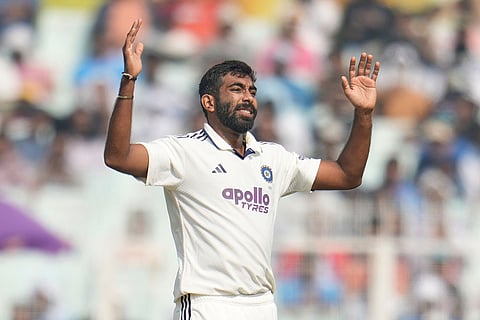India's Jasprit Bumrah reacts after bowling a delivery to South Africa's captain Temba Bavuma on the third day of the first cricket test match between India and South Africa in Kolkata, India.