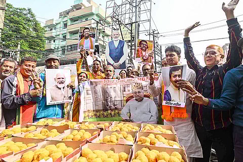 BJP supporters celebrate NDA's victory in the Bihar Legislative Assembly elections, in Patna.