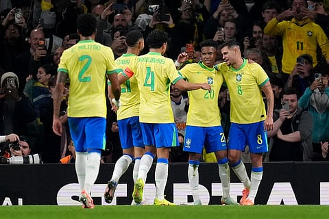 Brazil's Estevao, second right, celebrates scoring their side's first goal of the game during an international soccer match between Brazil and Senegal at the Emirates Stadium, London.