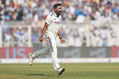 India's Mohammed Siraj celebrates the dismissal of South Africa's Keshav Maharaj on the third day of the first cricket test match between India and South Africa in Kolkata, India.