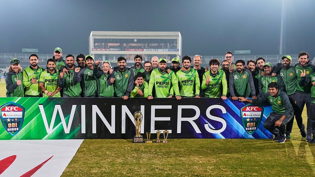 Pakistan players and officials pose with the trophy after winning the ODI series against Sri Lanka in Rawalpindi. - AP