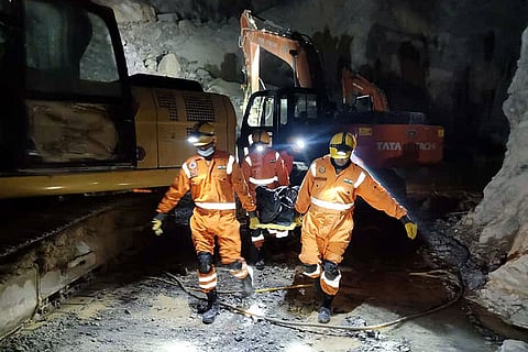 In this image, Rescue operation underway after a portion of a stone quarry collapsed, in Sonbhadra, Uttar Pradesh. Around 10 people are feared trapped, and one body has been recovered so far.
