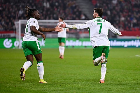 Ireland's Troy Parrott, right, celebrates after scoring his side's second goal during the World Cup 2026 group F qualifying soccer match between Hungary and Ireland in Budapest, Hungary.