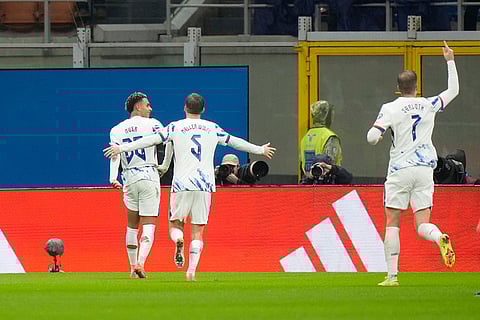 Norway's Antonio Nusa, left, celebrates with teammates after scoring his side's opening goal during the 2026 World Cup Group I qualifier soccer match between Italy and Norway in Milan, Italy.