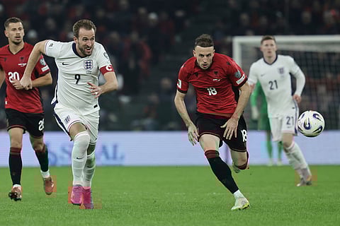 England's Harry Kane, left, and Albania's Ardian Ismajli go for the ball during the World Cup 2026 group K qualifying soccer match between Albania and England, in Tirana, Albania.