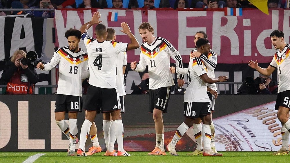 Germany's Nick Woltemade, center, is congratulated after scoring his sides second goal during the 2026 World Cup group A qualifying soccer match between Luxembourg and Germany in Luxembourg. - | Photo: AP/Geert Vanden Wijngaert