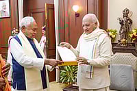 Photo: PTI : Bihar Governor Arif Mohammad Khan receives a letter recommending the dissolution of the current government from state Chief Minister Nitish Kumar during a meeting, in Patna.